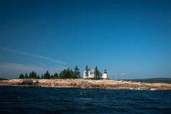 Winter Harbor Light On Mark Island Shoreline in Maine